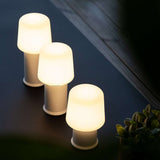 White Ambience Lamp Intelligent+ with London base in mixed sizes, sleek outdoor lighting with stainless steel details.