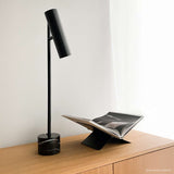 Black Expo Table lamp with aluminum body and polished marble base on a white background.