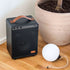 Boom 150 Bluetooth speaker in black with steel and aluminum details, portable design with buttons on top