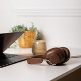 Brown over-ear Touch 310 headphones with cushioned ear cups and adjustable headband.