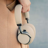 Beige SACKit Touch 410 wireless headphones with rotatable earcups and on-headphone controls.