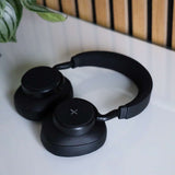Black SACKit Touch 410 wireless headphones with rotatable earcups and on-headphone controls.