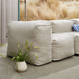 Soft Sofa Outdoor 3-seater in Kirra Sand with soft cushions and a low backrest.