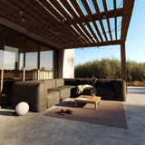 Soft Sofa Outdoor 4-seater corner sofa in Kirra Noir fabric on a patio setting