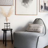 Medley Lounge Chair in Medley Grey fabric with soft, rounded shape and backrest on a white background