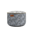 Black limited edition Pouf Noir with geometric jacquard textile and linen stitches, round shape.
