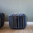 Multi-colored Lounge Chair and Pouf Paul Smith with linear design and cotton upholstery in modern style