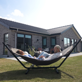 Cobana Grey hammock with black powder-coated aluminum frame outdoors on a wooden deck