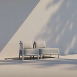Kirra Lounge Sofa open end left in Kirra Sand with powder-coated aluminum frame and Olefin textile cushions outdoors