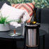 Satin polished stainless steel wine cooler with leather handle and included ice tong on a white background