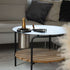 Satin polished stainless steel wine cooler with leather handle and included ice tong on a light surface