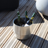 Stainless steel wine bucket with isolated design, round shape, and 9-liter capacity for ice or bottles.