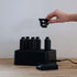 Compact white ABS-plastic battery charging station with six slots and a 1.5m power cable