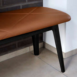 Nordic Bench in solid beech wood with Terra Black leather seat and black lacquer finish.
