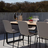 Taupe outdoor dining chair with black powder-coated steel frame and recycled plastic shell