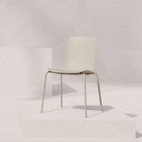 Taupe outdoor dining chair with black powder-coated steel frame and recycled plastic shell.