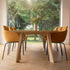 Edge Dining Table made of European oak with detailed facets in a bright indoor setting