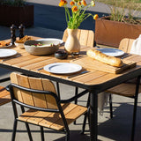 Kirra Dining Table 150x90 with powder-coated aluminum frame and teak wood top in outdoor setting