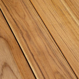 Kirra Dining Table with taupe powder-coated aluminum frame and untreated teak wood top, outdoor setting close-up.