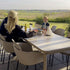 Kirra Dining Table with taupe ceramic tabletop and powder-coated aluminum frame for outdoor use