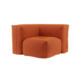 Soft Sofa Indoor corner module in vibrant orange jaquard fabric with soft, rounded edges.
