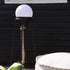 Black powder-coated stainless steel Patio Accessory Stand with a round Light 155 on top outdoors
