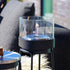 Black powder-coated stainless steel Patio Accessory Stand with Bio Lamp featuring heat-resistant glass and ceramic fiber cotton.