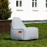 Cobana Junior Lounge Chair and pouf in light grey fabric with a soft, rounded shape.