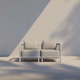 Kirra Lounge Sofa 2-seater in Kirra Sand with aluminum frame and cushioned seats for outdoor use.