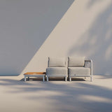 Kirra Lounge Sofa 2-seater in Kirra Sand with powder-coated aluminum frame and Olefin cushions outdoors
