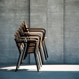 Kirra Patio Chair with powder-coated aluminum frame and teak wood seat and backrest in natural wood tone