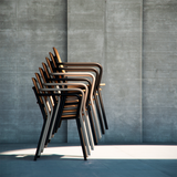 Kirra Patio Chair with powder-coated aluminum frame and teak wood seat and backrest in natural wood tone