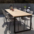 Rectangular outdoor dining table with rounded legs, powder-coated aluminum frame, and teak wood top
