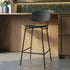 Black wood bar stool with supportive backrest and footrest in a modern kitchen by sackit