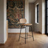Low bar stool with backrest, upholstered in Terra Safari leather with a powder-coated steel frame.