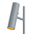 Grey aluminum table lamp with marble base and warm light, modern indoor lighting design.