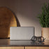 Move 50 Care portable speaker with dual-sided playback and biodegradable frame in neutral color