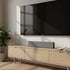 Sleek rectangular soundbar with textile front and ABS plastic body in neutral setting