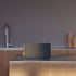 Move 50 Care portable speaker in steel color with biodegradable frame and silicone buttons