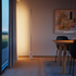 Sleek polished aluminum floor lamp with vertical frosted LED strip and marble base.