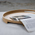 Round Nordic Serving Tray in natural oak with subtle handles and a 5 cm rim on a light background.