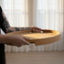 Round Nordic Serving Tray in natural oak with subtle handles and a raised rim on a light surface.