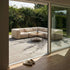 Soft Sofa Outdoor corner sofa in a neutral beige fabric set in a garden setting