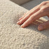 Bouclé beige Soft Sofa Outdoor pouf with soft, rounded shape for versatile outdoor seating.
