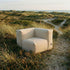 Soft Sofa Outdoor corner sofa in beige boucle fabric with soft, rounded cushions and low backrest