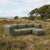 Kirra Olive Soft Sofa Outdoor 3-seater with pouf in a relaxed outdoor setting