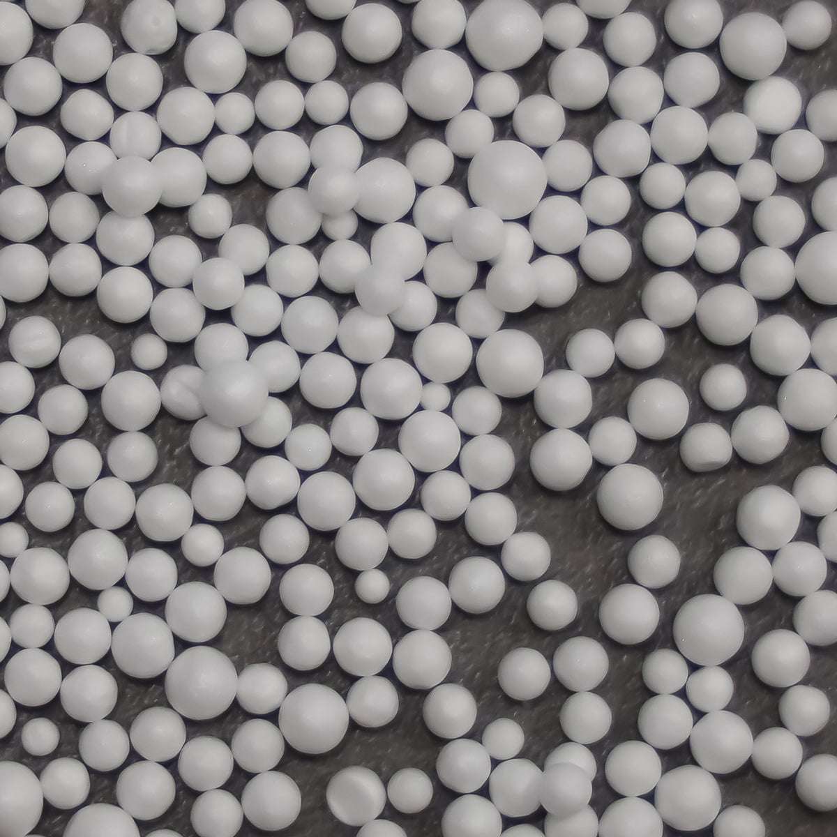 Box of 100-liter refill EPS beads for bean bags, white beads visible inside transparent packaging.