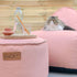 Round Cobana Grey pouf with durable fabric and hand-sewn stitches for indoor and outdoor use