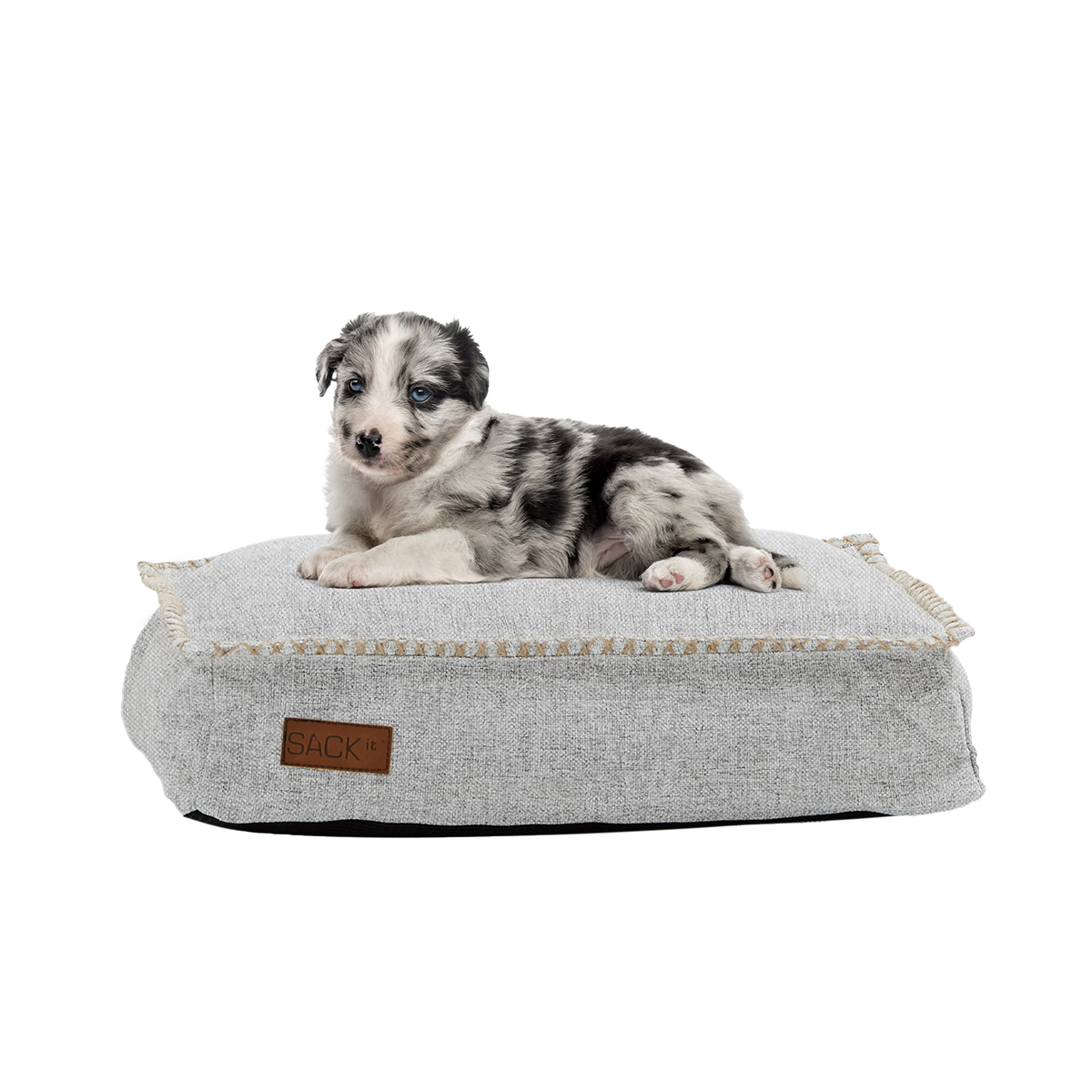 Mini dog bed in Cobana Sand Melange fabric with non-slip bottom and soft filling.