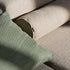 Close up of beige and green outdoor sofa cushions showing durable woven fabric and clean Scandinavian design by sackit, made for Nordic weather